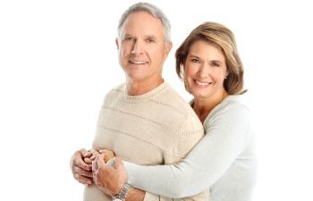 Elderly couple with perfect smiles.